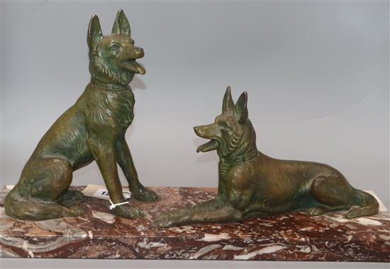 An Art Deco patinated spelter model of two dogs, on marble base length 52cm